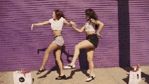 Two funny young girls on the street gif animation